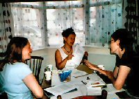 Photo of the project's three original principal investigators in a team meeting
